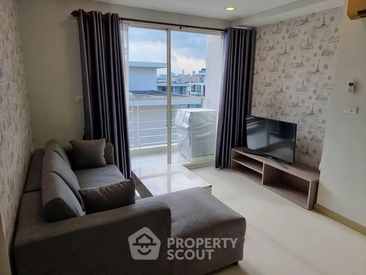 Modern living room with balcony view in urban apartment