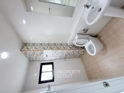 Modern bathroom with sleek fixtures and stylish tile design