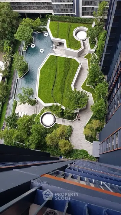 Stunning aerial view of modern garden with geometric design in urban residential complex.