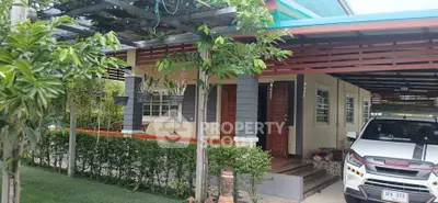 Charming suburban home with lush garden and covered carport, perfect for family living.