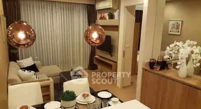 Stylish modern living room with open layout and elegant decor, featuring cozy seating and ambient lighting.