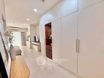 Spacious modern living room with built-in storage and natural light
