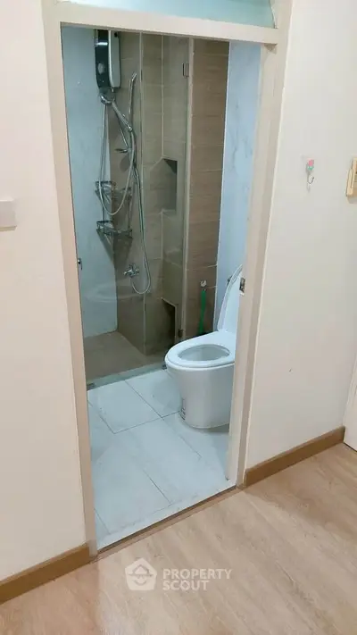 Modern bathroom with shower and toilet in a cozy apartment