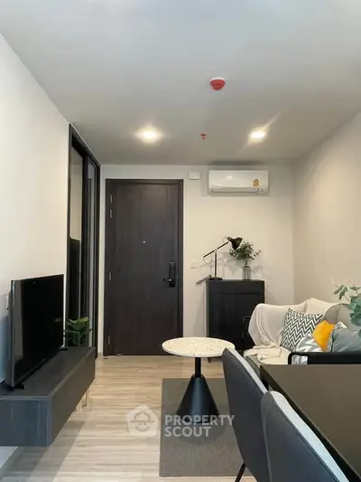 Modern living room with sleek furniture and stylish decor in a contemporary apartment.