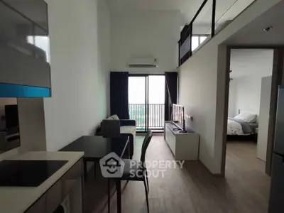 Modern loft apartment with open living area and balcony view