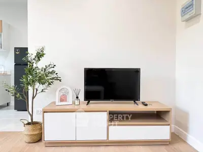 Modern living room with sleek TV stand and minimalist decor, perfect for contemporary living.