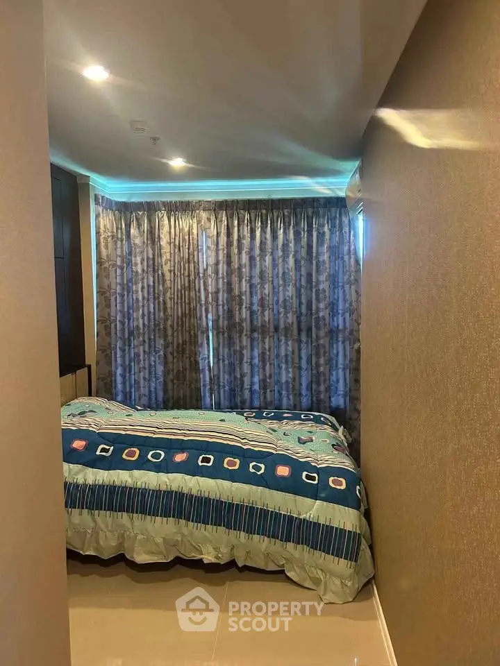 Cozy bedroom with modern decor and large window curtains