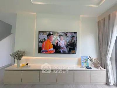 Modern living room with sleek TV setup and elegant decor