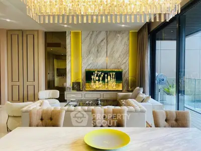 Luxurious living room with elegant chandelier and modern decor