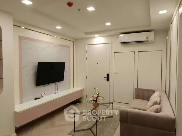 Modern living room with stylish decor and wall-mounted TV