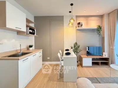 Modern open-plan living room with stylish kitchen and cozy dining area