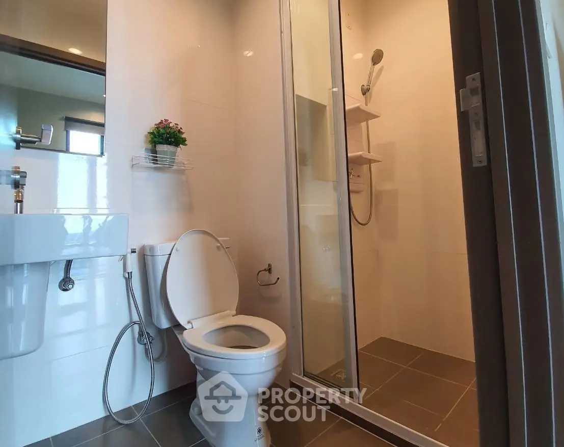 Modern bathroom with shower and toilet in sleek design