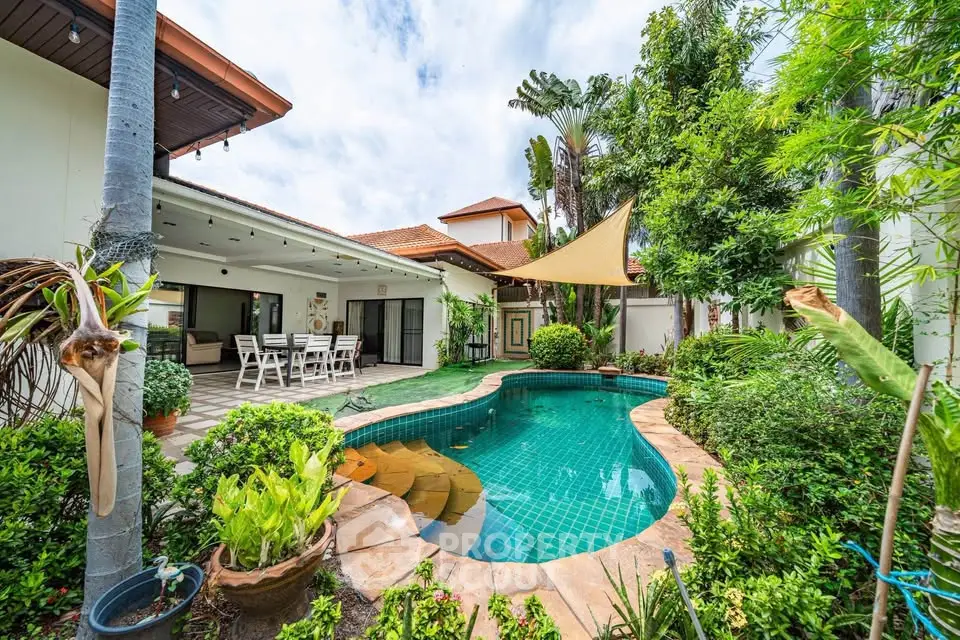 Stunning backyard oasis with pool and lush garden in a modern home