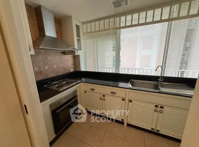 Charming kitchen with modern appliances and sleek cabinetry, perfect for culinary enthusiasts.