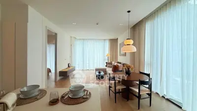 Spacious modern living room with elegant dining area and large windows