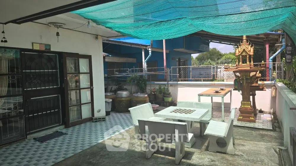 Charming rooftop terrace with traditional decor and outdoor seating area