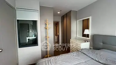 Modern bedroom with sleek design and ample storage space