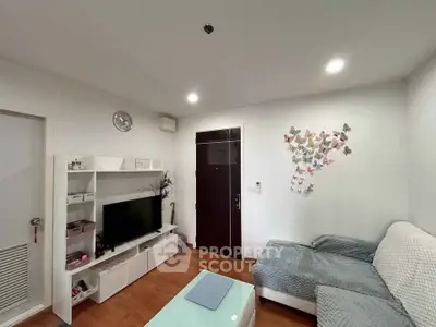 Cozy living room with modern decor and butterfly wall art