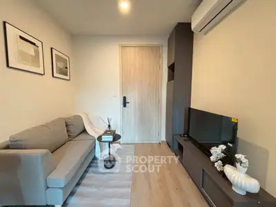 Cozy modern living room with stylish decor and air conditioning