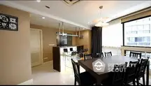 Spacious dining area with modern kitchen in luxury apartment