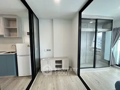 Modern apartment interior with open kitchen and glass partitions