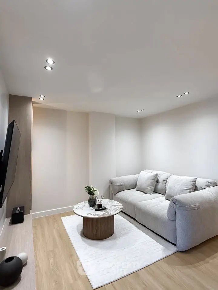 Modern living room with cozy sofa and stylish decor