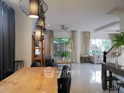 Spacious modern living room with elegant lighting and garden view