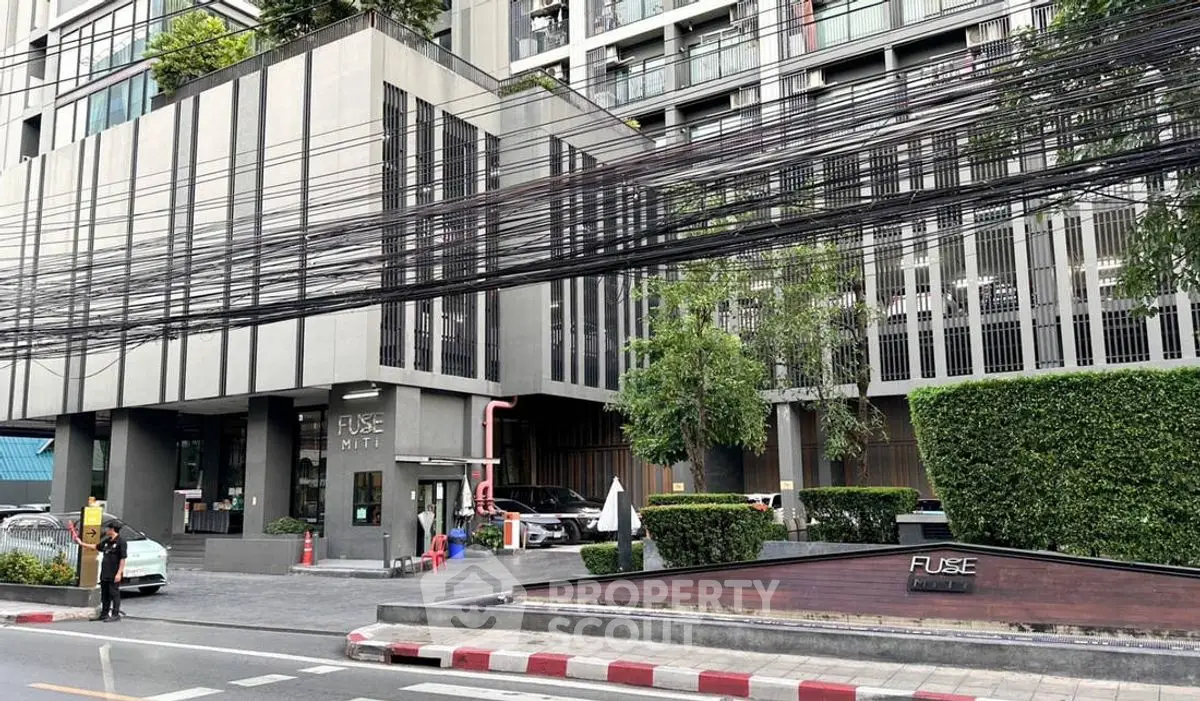 Modern urban building exterior with lush greenery and sleek design