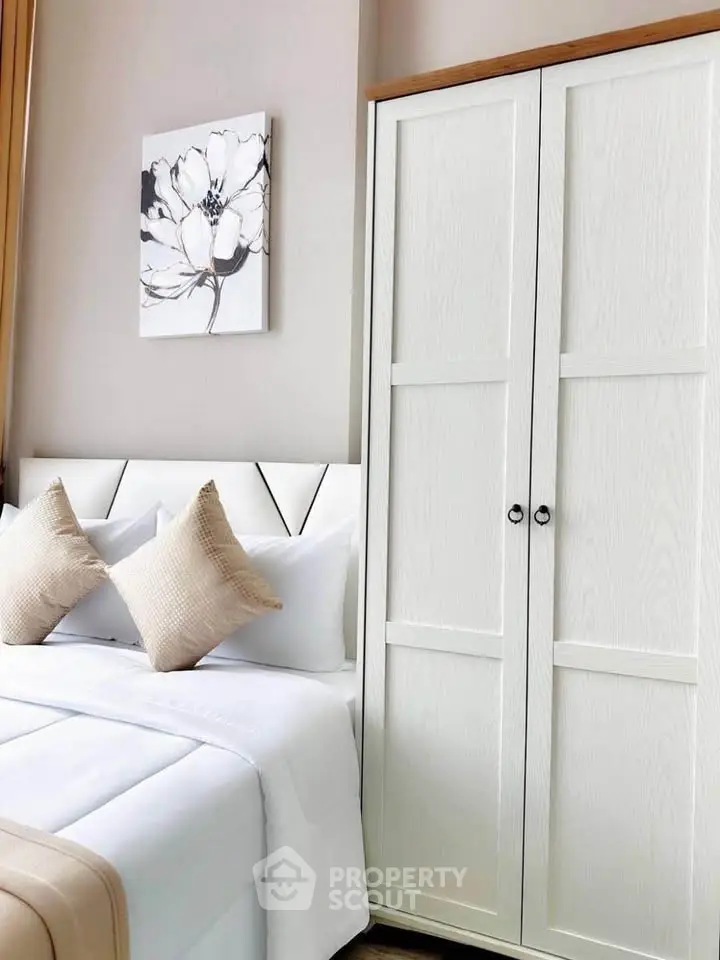 Elegant bedroom with modern white wardrobe and stylish decor