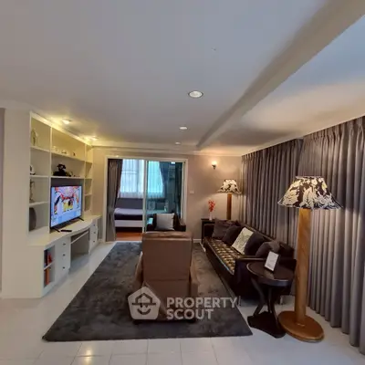 Spacious living room with cozy seating and modern decor, perfect for relaxation and entertainment.