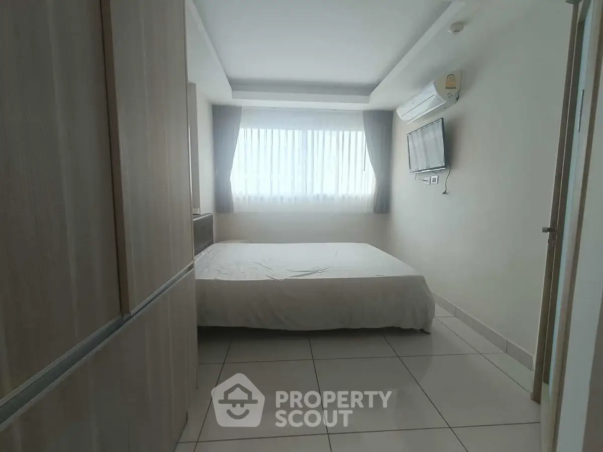 Modern bedroom with natural light and sleek design