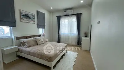 Modern bedroom with cozy decor and natural light