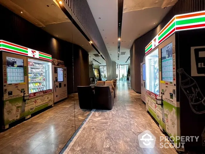 Modern building entrance with vending machines and stylish seating area