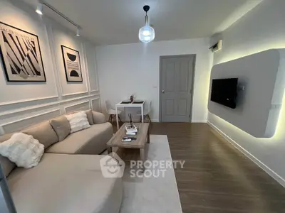 Modern living room with stylish decor and cozy seating area, perfect for relaxation and entertainment.