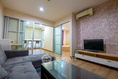 Modern living room with stylish decor and open layout in a cozy apartment.