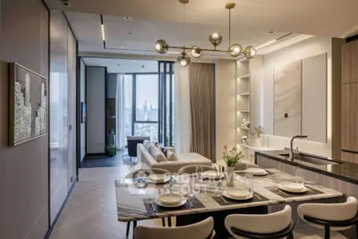 Luxurious open-plan living and dining area with modern decor and stunning city view.