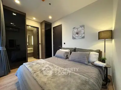 Cozy modern bedroom with elegant decor and soft lighting