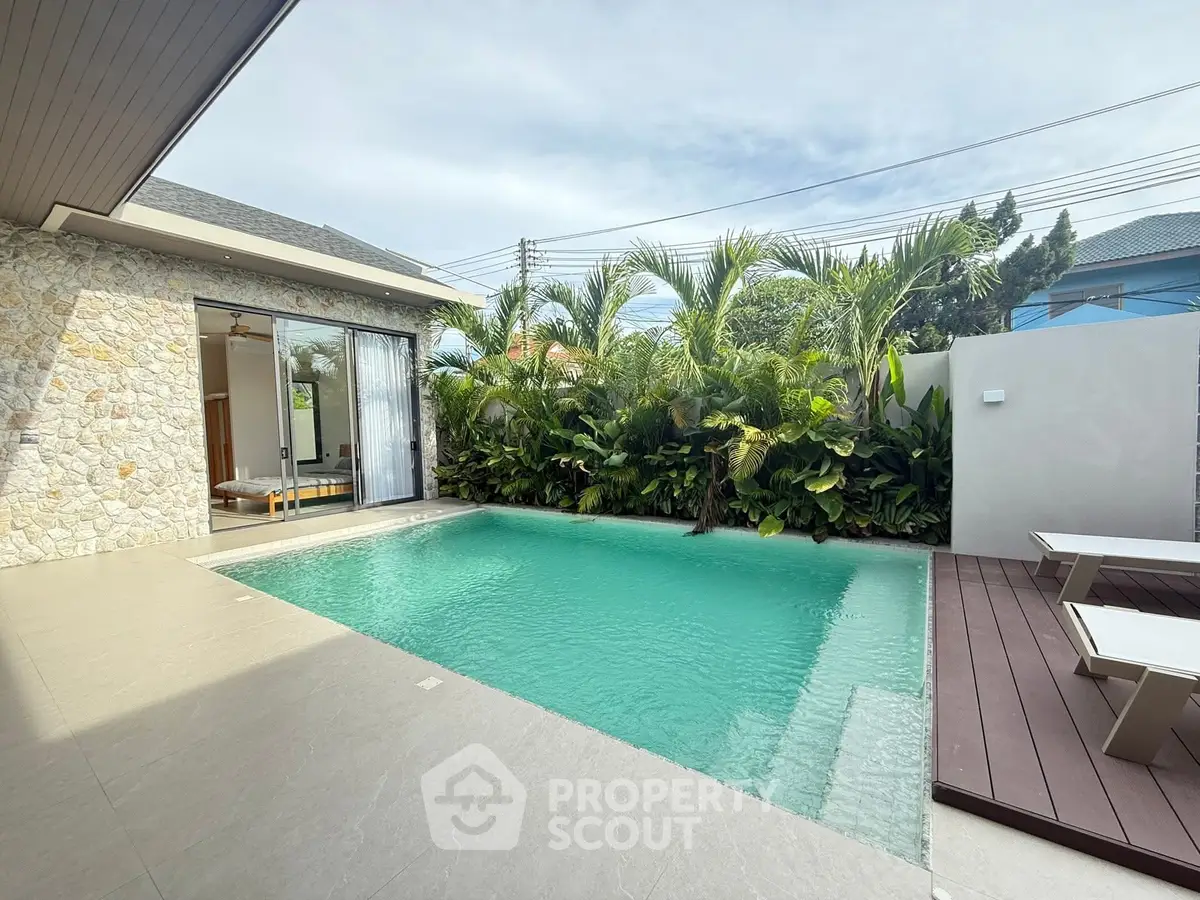 Luxurious villa with private pool and lush garden, perfect for relaxation and entertaining.