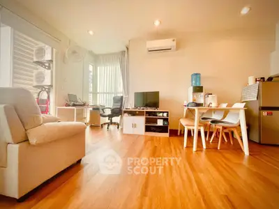 Spacious living room with modern furniture and wooden flooring