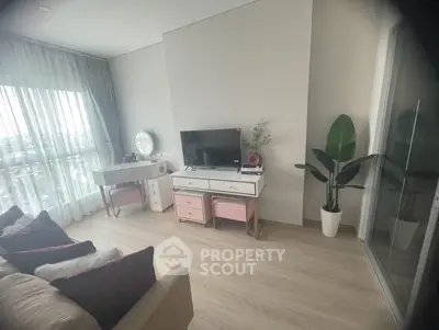 Modern living room with stylish decor and large window view