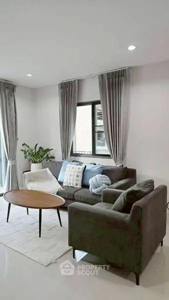 Modern living room with stylish furniture and natural light