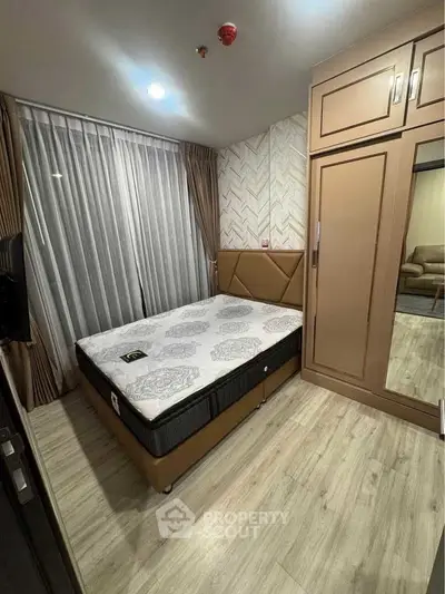 Cozy bedroom with modern decor and ample storage space