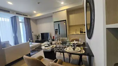 Modern living room with elegant dining area and open kitchen in luxury apartment
