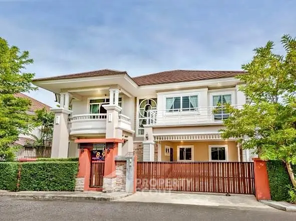 Elegant two-story house with lush greenery and modern architecture