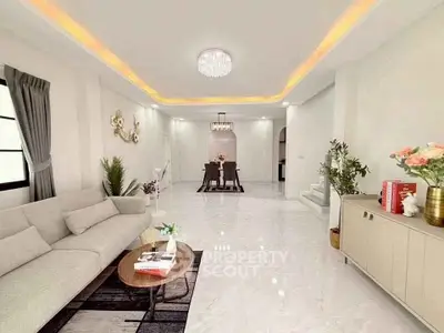 Spacious modern living room with elegant decor and open dining area