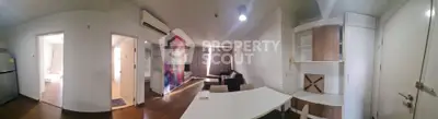 Spacious open-plan living area with modern decor and ample natural light.