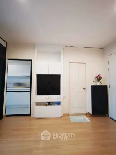 Modern living room with sleek TV unit and minimalist decor