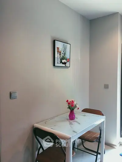 Cozy dining nook with modern table and chairs, perfect for intimate meals in a stylish home.