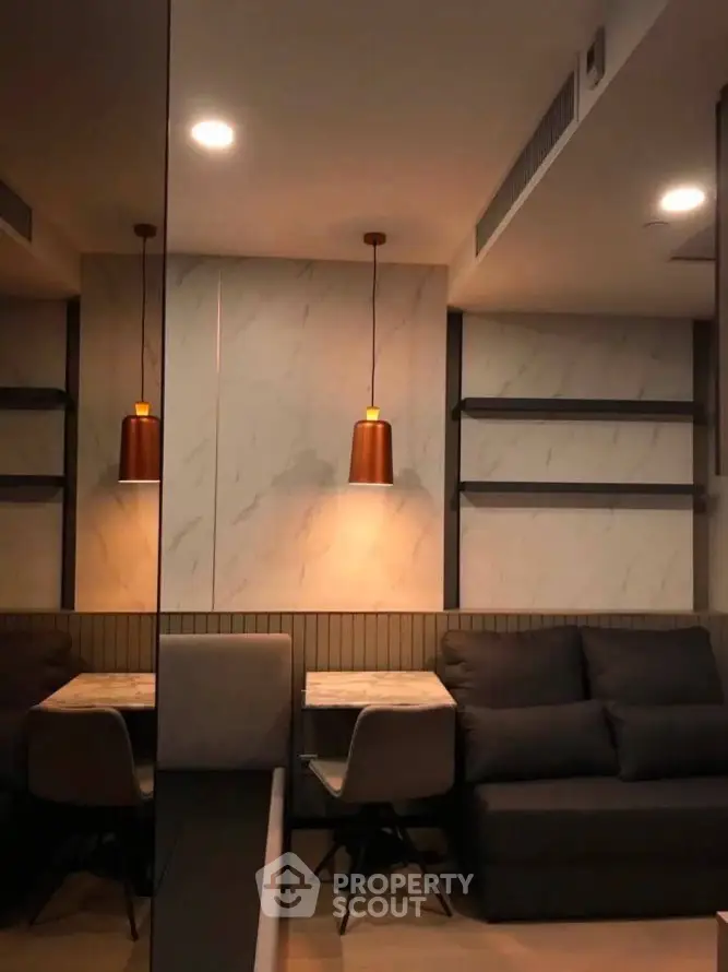 Modern living room with stylish lighting and cozy seating area