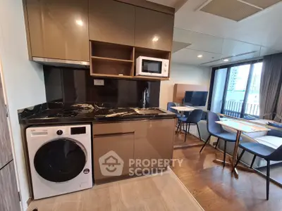 Modern kitchen with sleek appliances and open layout in a stylish apartment